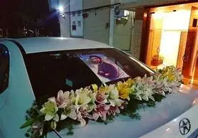 ماشین‌عروس مزین به عکس شهید حججی